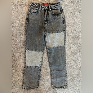 Distressed black patch jeans